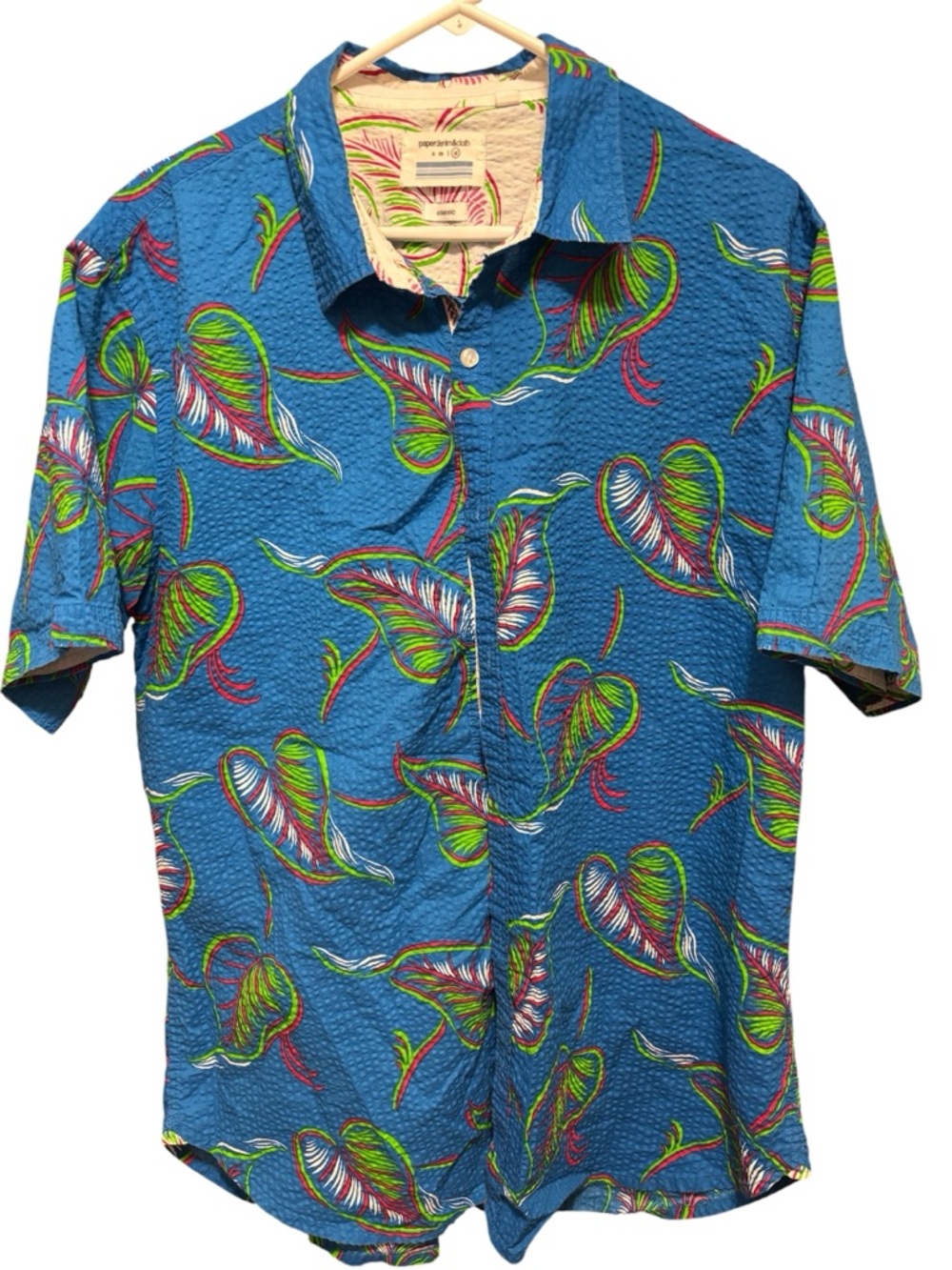 This tropical button-down shirt is‎ from the brand Paper Denim & Cloth.